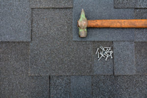 shingles on the roof with regular hammer