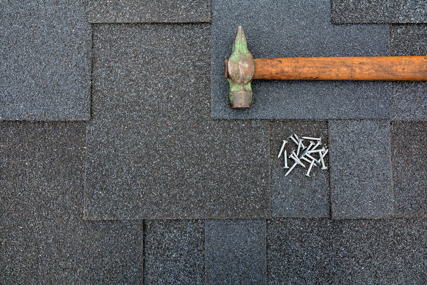 shingles on the roof with regular hammer