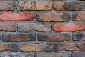 Old wall of red bricks for background