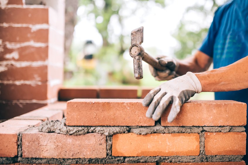 a contractor working on masonry