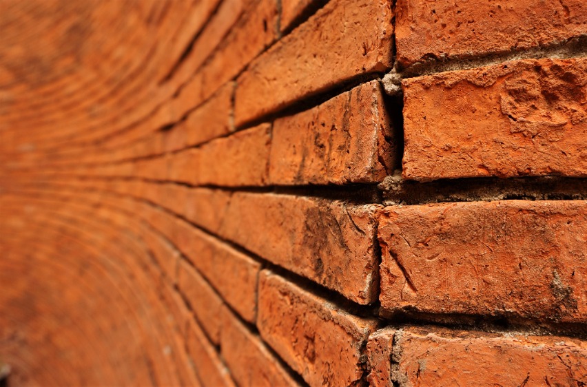 Rough red brick wall 